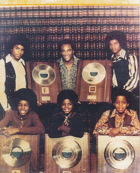 The Jackson Five posing with their records