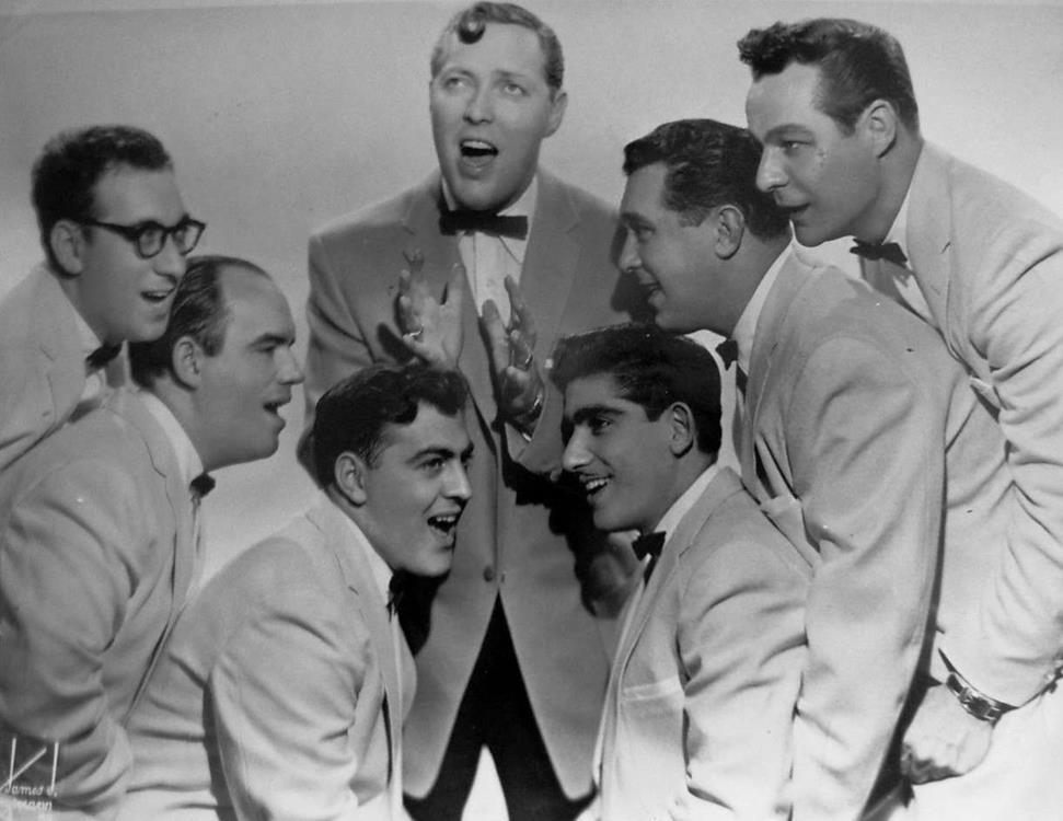 Bill Haley and His Comets in 1956. Left to right: Rudy Pompilli, Billy Williamson, Al Rex, Bill Haley, Johnny Grande, Ralph Jones, and Franny Beecher