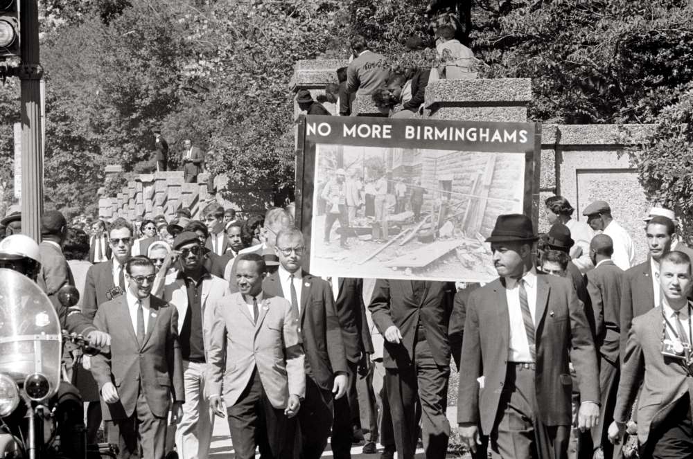 Congress of Racial Equality and members of the All Souls Church march in memory of the 16th Street Baptist Church bombing victims on September 22, 1963