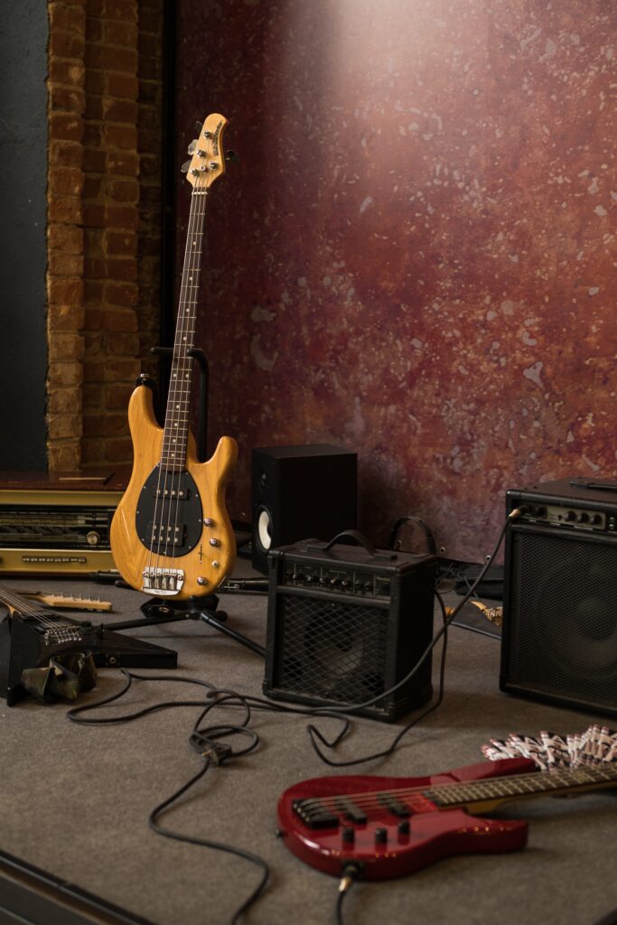 Various guitars and amplifiers on stage image