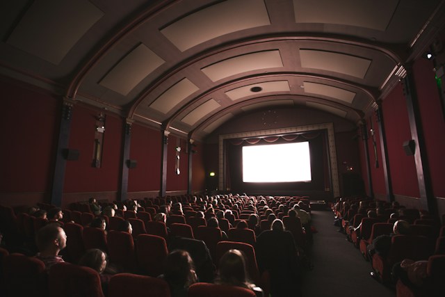 A cinema with a movie playing image