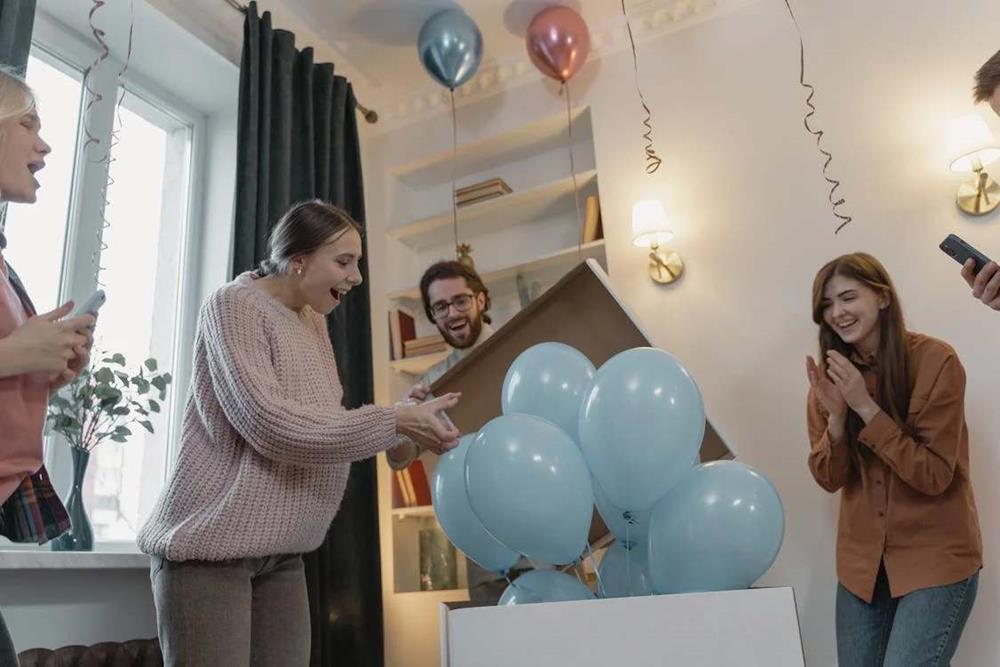 Gender reveal party with balloons