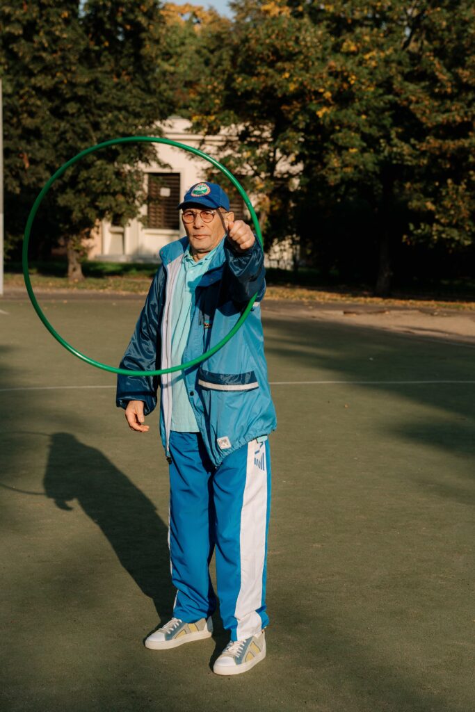 A woman wearing a blue tracksuit image