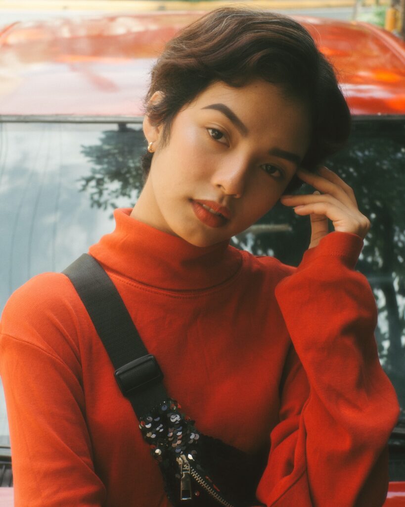 A woman wearing a red turtleneck image