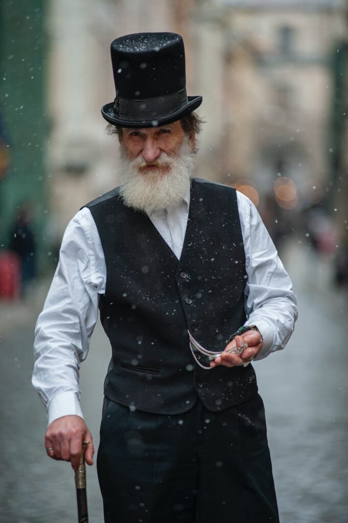 An old man wearing a top hat image