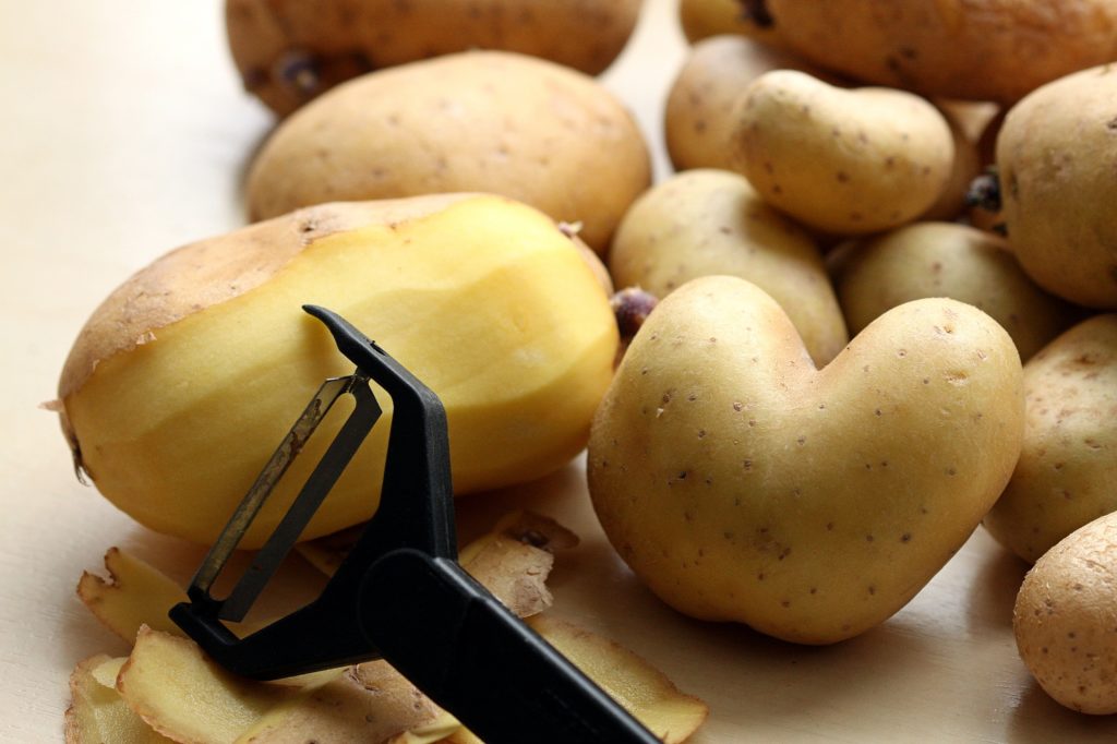 potatoes with a peeler