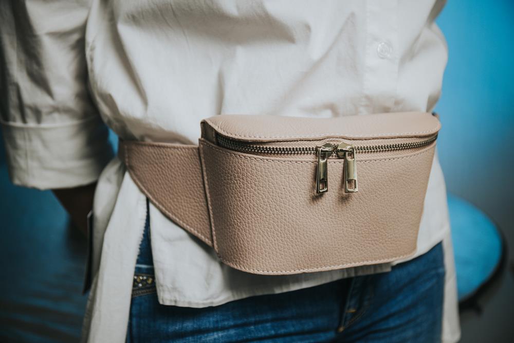 Woman wearing a fashionable leather fanny pack