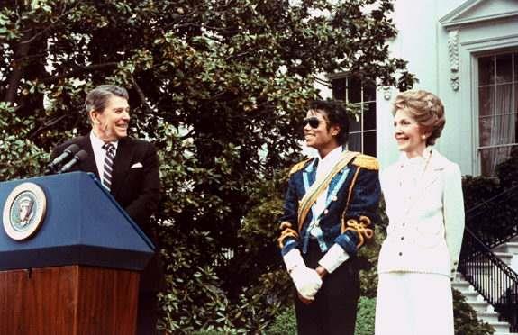 President Ronald Reagan presents Michael Jackson with an award for his work against drunk driving at a White House ceremony in 1984