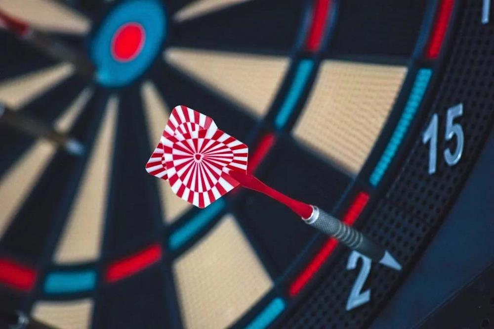 Red and white dart on a dartboard