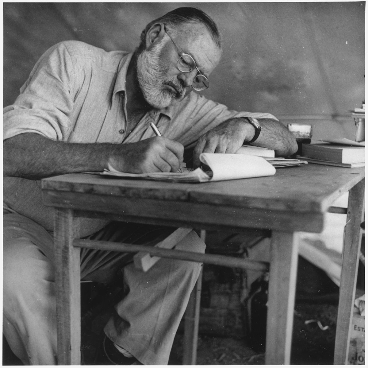 Ernest Hemingway Writing at Campsite in Keny