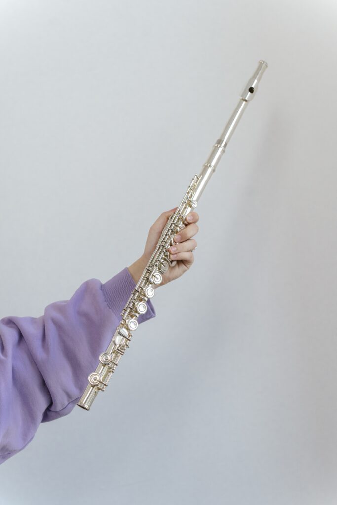 A person holding a flute image