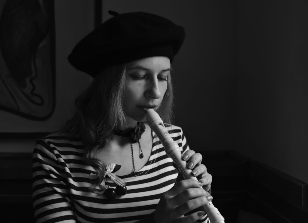 A person playing a flute image