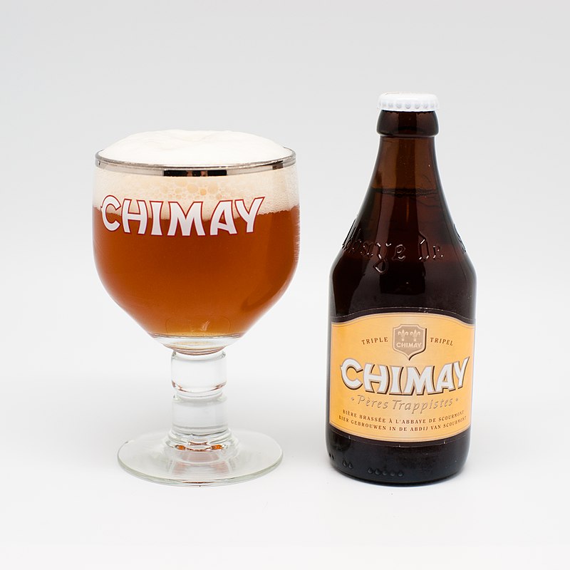 A Chimay tripel beer with its branded glass