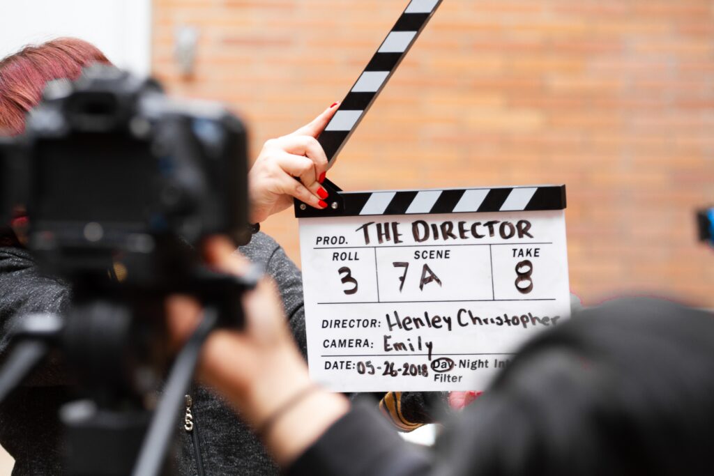 A man holding a clapper board image