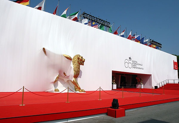 the entrance to the Venice festival with the Golden Lion statue