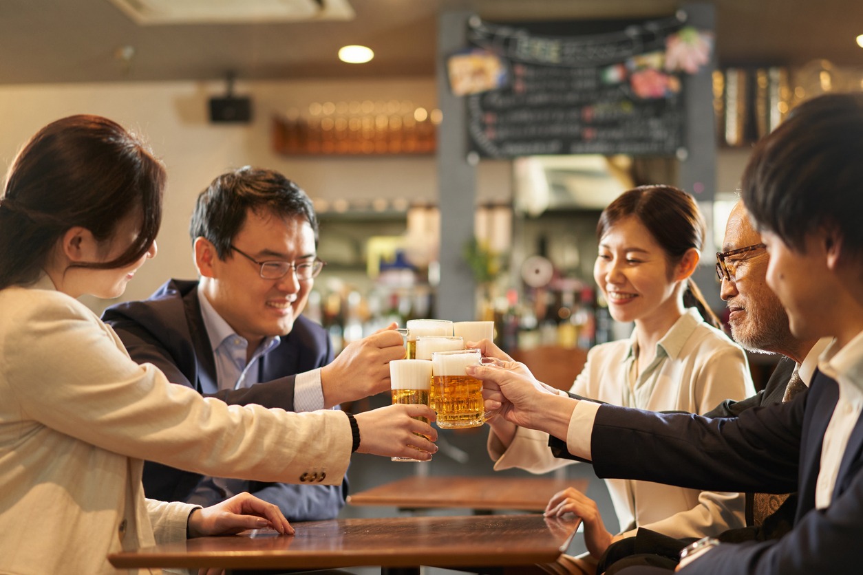 Chinese businesspeople toasting beer at a craft beer station