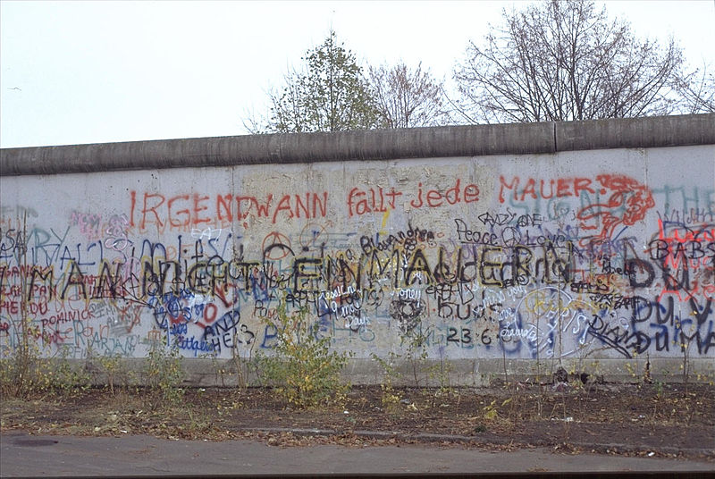 a photo of the Berlin wall with vandalism