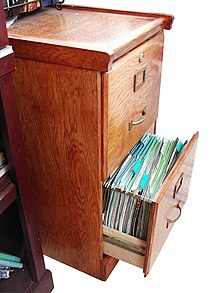 A wooden filing cabinet image