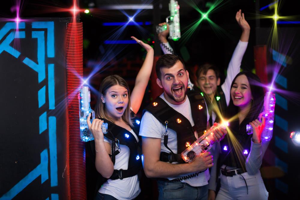 Friends having fun at a laser tag party