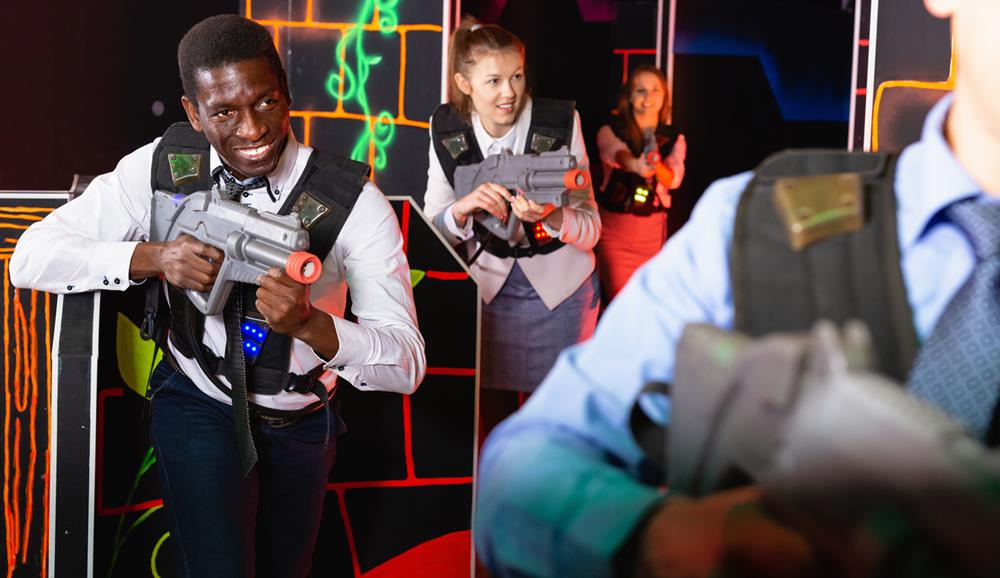 Men and women at a laser tag game
