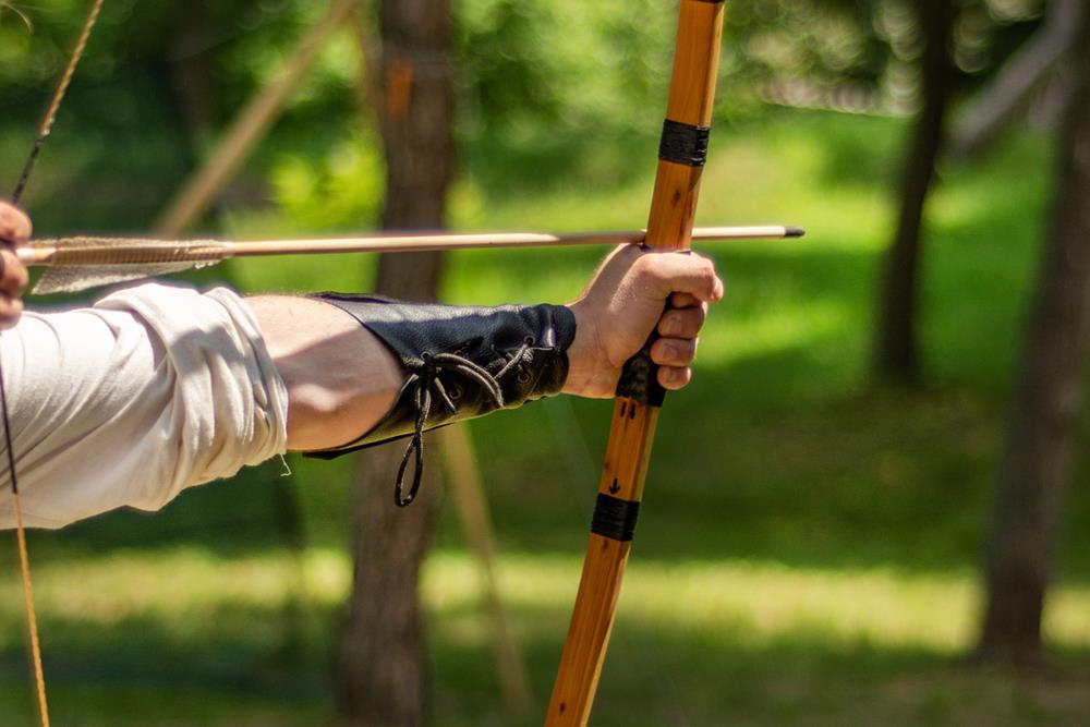 Person using traditional archery equipment