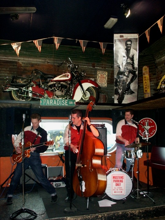 Classic instruments associated with rockabilly are a hollow-body guitar, an upright bass, and a pared-down drum kit