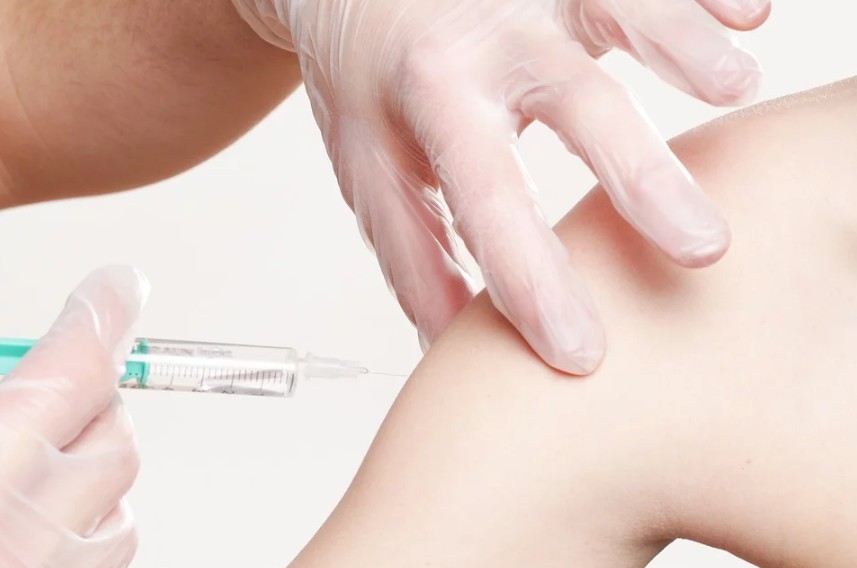injecting vaccine on a patient