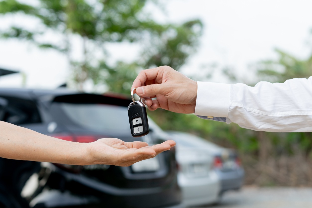 lease, rental car, sell, buy. The dealership manager sends the car keys to the new owner. Sales, loan credit financial, rent vehicle, insurance, renting, Seller, dealer, installment, car care business