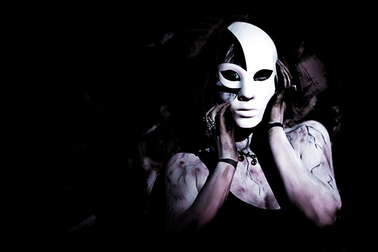 girl with white mask on black background