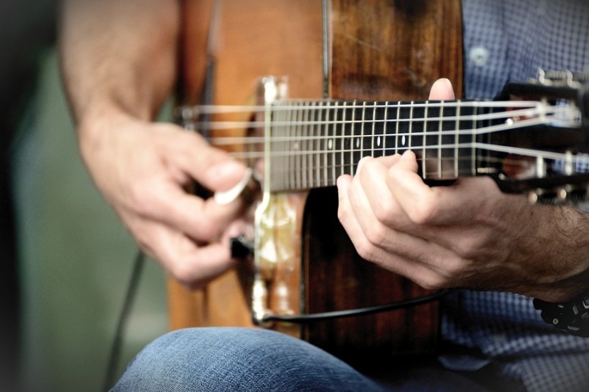 person playing the guitar