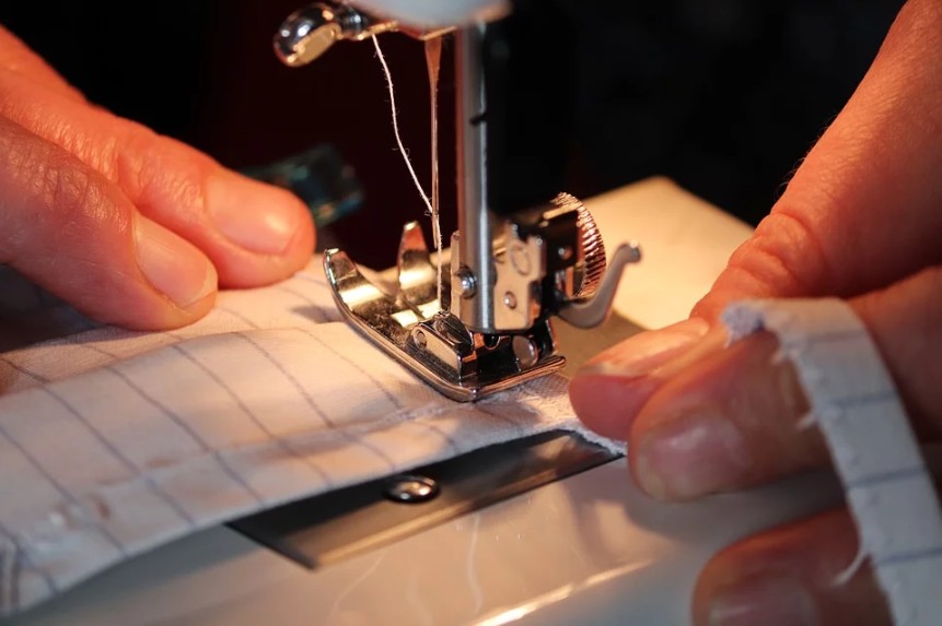 person using a sewing machine