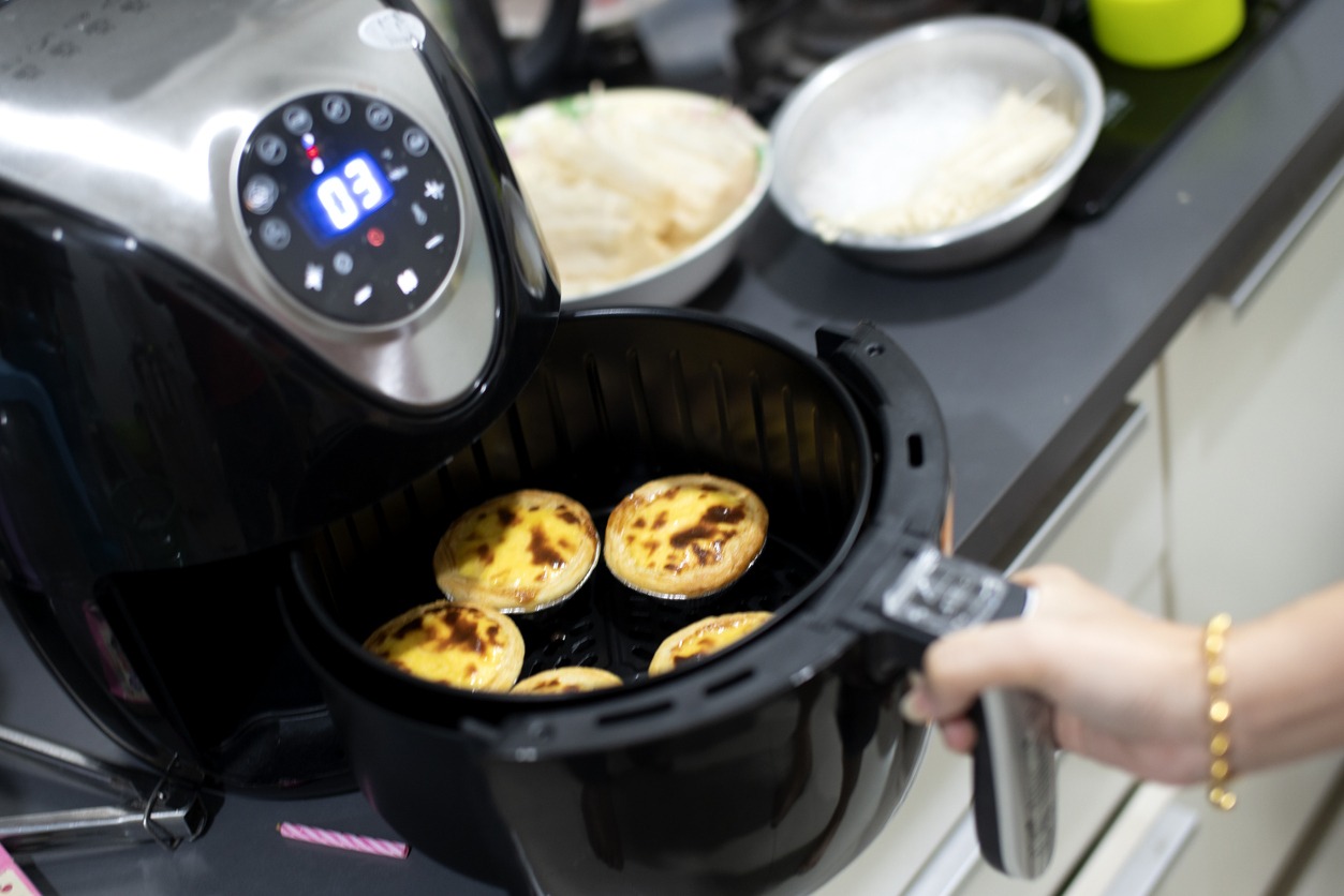 Air fryer machine in the home, Egg Tart (selective focus )