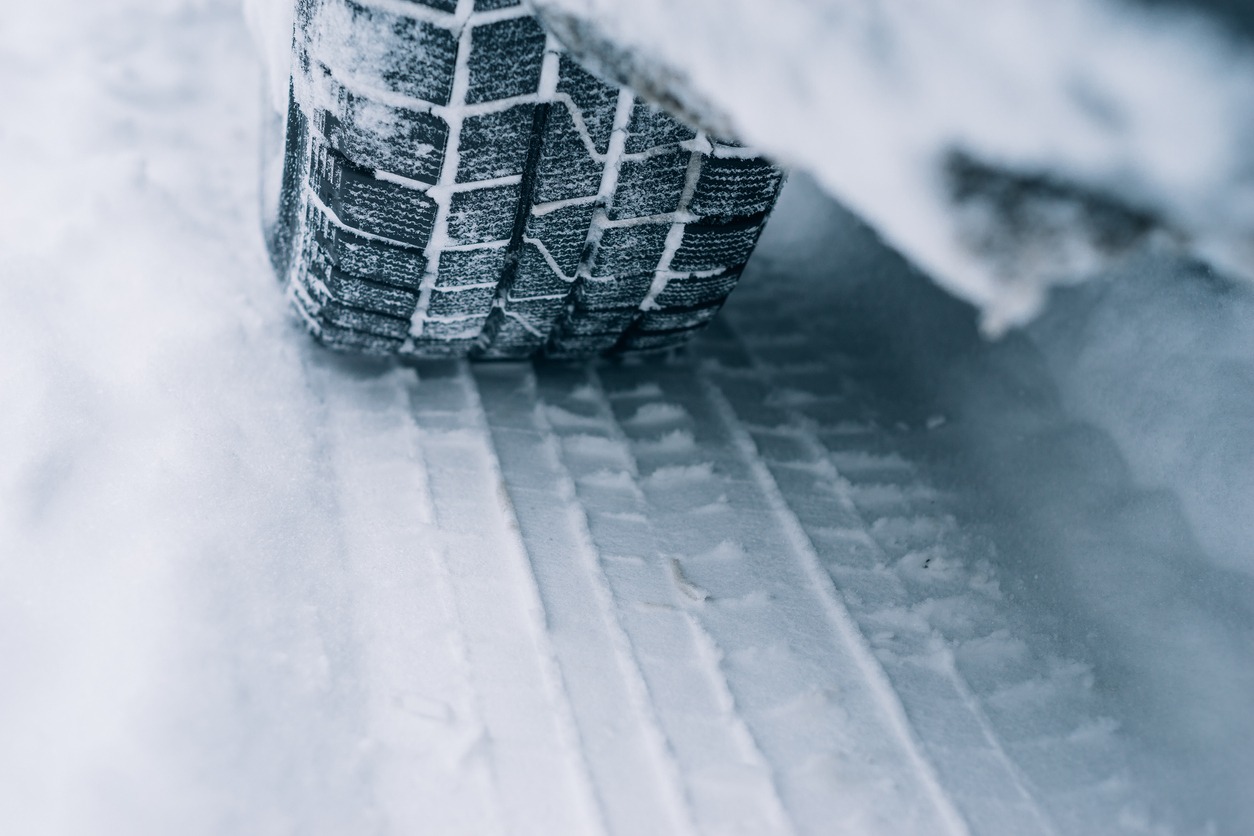 All-season tire track on snow, winter tire concept
