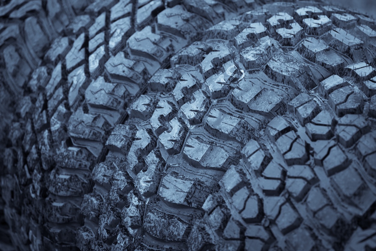 Color close-up of some wet knobby car tires