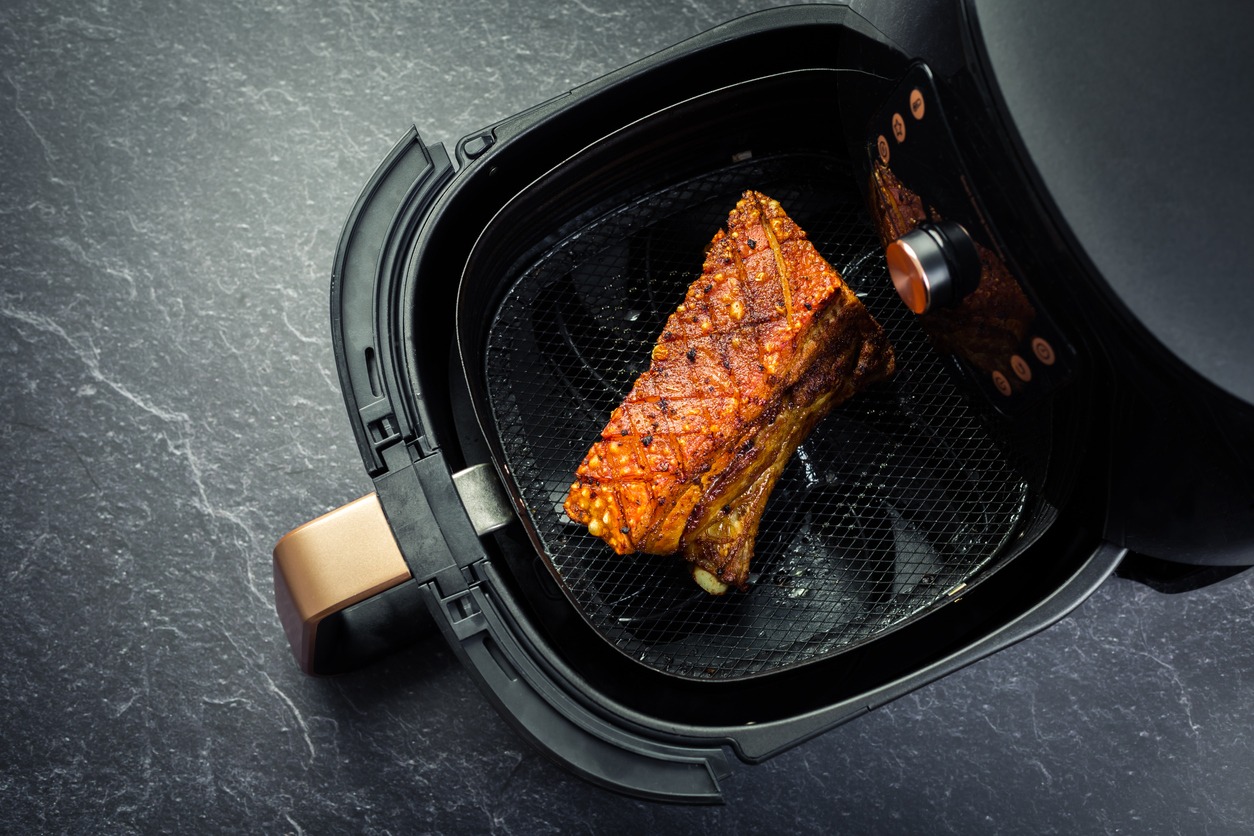 Cooking crispy pork belly in the air fryer. Fast and easy crispy food cooking with little or no fat by circulating hot air inside the basket
