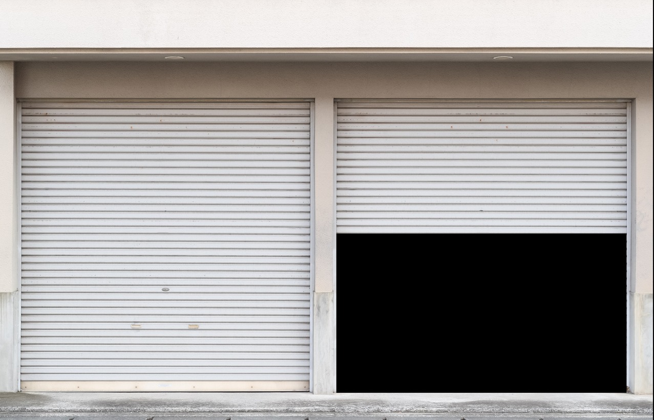 Garage with two entrances and open shutter