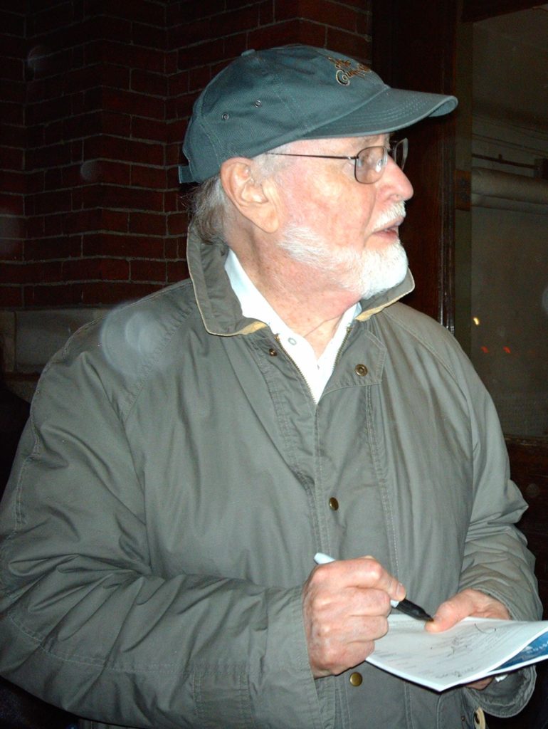 Williams signing an autograph after a concert in 2006