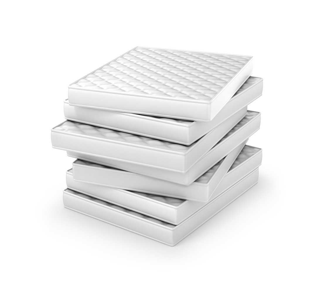 a stack of white mattresses isolated on a white background