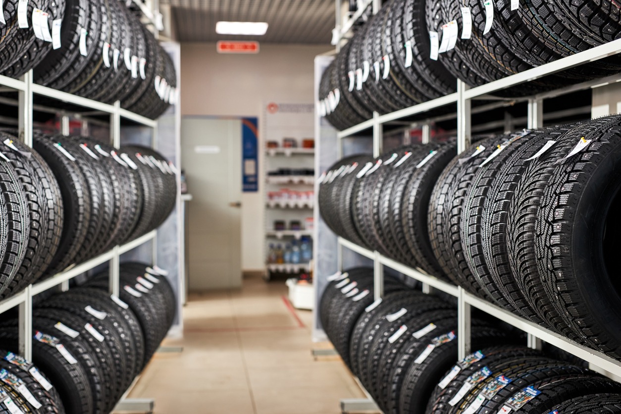 assortment of tires for a car in a repair garage