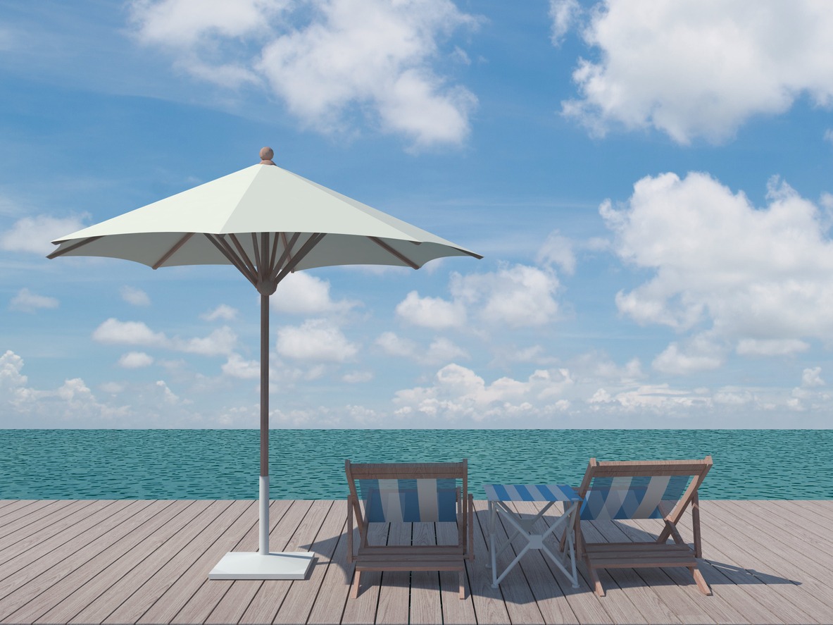two chairs and a white umbrella on the wooden pier
