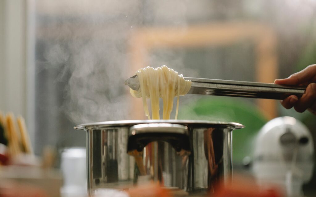 A stainless steel pot cooking pasta image