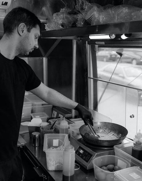 Man in Black T-shirt Cooking