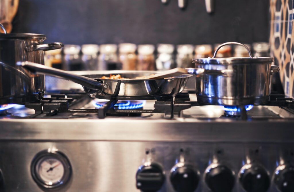 Stainless steel cookware on a stove image