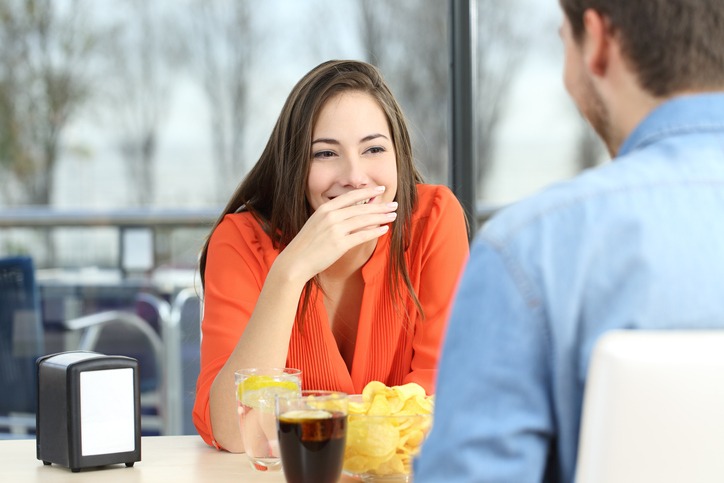 Woman smiling in a blind date