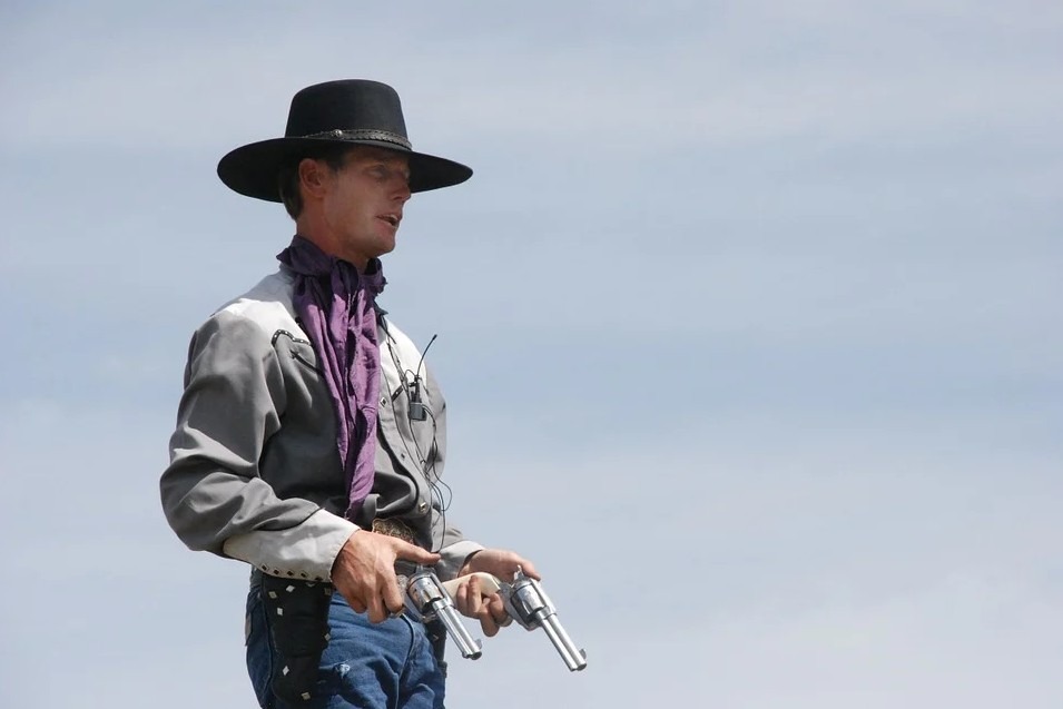 a cowboy with two guns