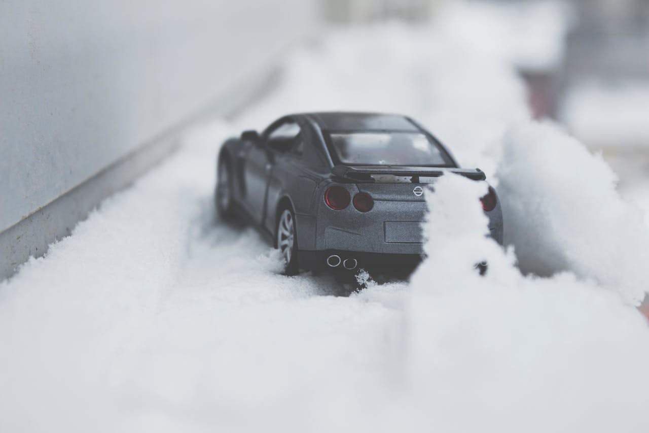 close-up photo of toy car on snow