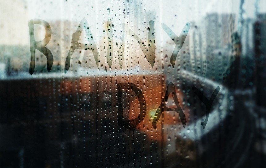 rainy day written on the glass