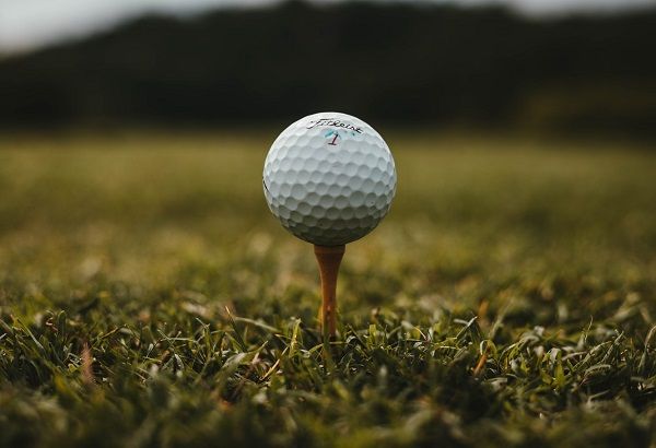 Golf ball in a tee