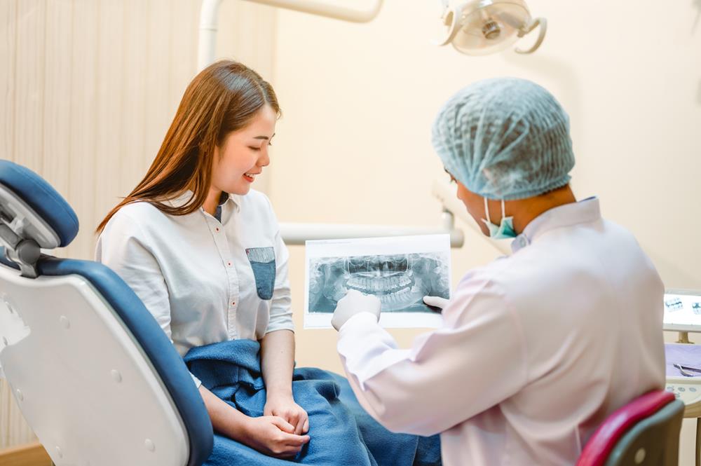 Dentist explaining X-ray results to the patient