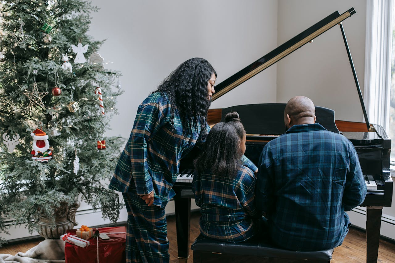family playing piano together